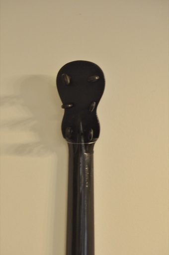 Headstock of Thibouville-Lamy romantic guitar with six granadillo tuning pegs in figure-eight pegbox