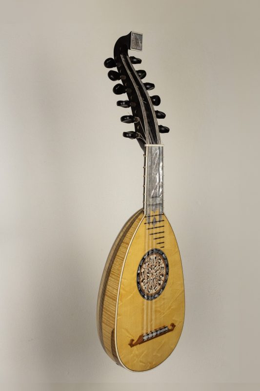 Front view of a 6-course Baroque mandolin by Chiara Frisio after Presbler 1790, Swiss spruce top with inlaid rosette and decorated pegbox