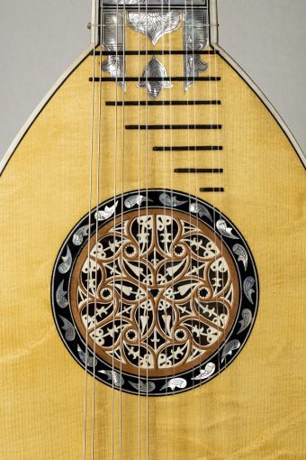 Detail of the pearwood and parchment rosette with inlaid decorative border on the Swiss spruce top of the Chiara Frisio mandolin