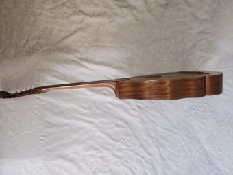 Opposite side profile of a Robert Hadaway bandora showing the festooned body outline and the soundboard