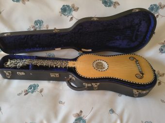Stephen Barber baroque guitar resting in its included blue-lined Kingham hard case