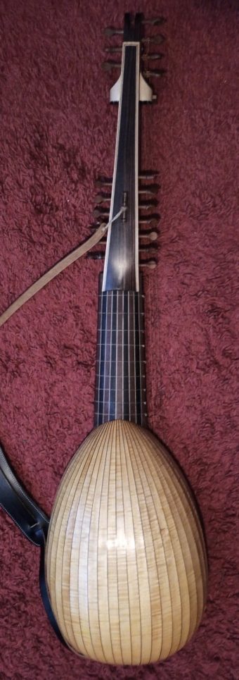 Back of the György Lőrinczi archlute showing the multi-rib flamed maple bowl, the neck and both pegboxes