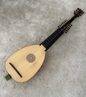 Front view of an archlute (liuto attiorbato) by György Lőrinczi (2020), spruce top with carved rosette, extended neck and two pegboxes