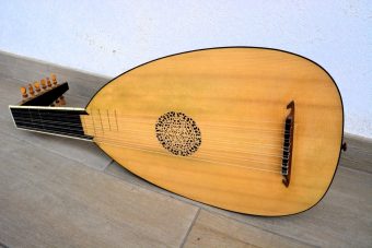 Full front view of the Jaume Bosser Renaissance lute showing the whole spruce soundboard, rosette, bridge and angled pegbox