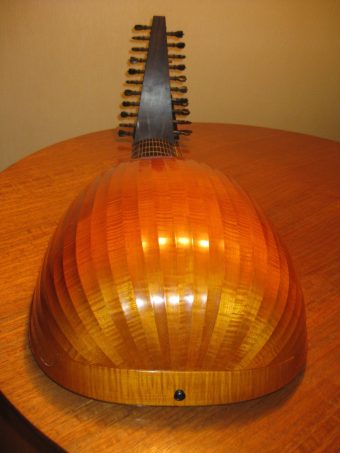 Back of the Hans Jordan baroque lute showing the bowl of 27 flamed maple ribs and the ebony neck