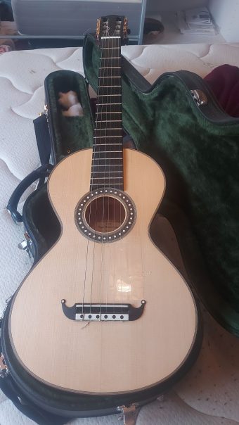 Front view of a Coffe-Goguette replica romantic guitar by Ángel Benito with spruce top, moustache bridge and inlaid rosette