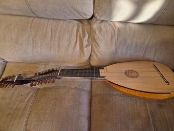 Angled view of the soundboard, rosette and bridge of the 13-course baroque lute (swan-neck) by Hans Hermann Herb (2009), with the pegboxes to the left