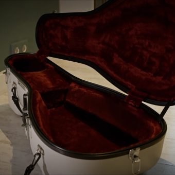 Open white Schuster hard case with burgundy plush lining, included with the Hans Jordan lute