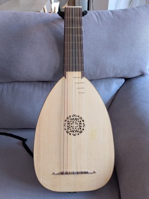 7-course renaissance lute in G by Nicolas Petit, front view with spruce top, carved rose and bridge