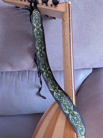 Neck of the 7-course lute by Nicolas Petit with the embroidered strap included in the sale