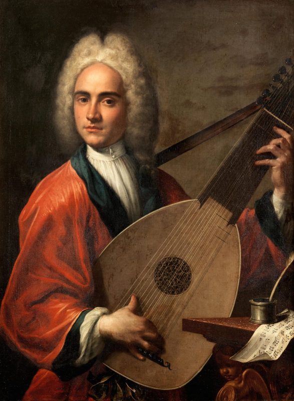Young bewigged musician in a red gown playing a large archlute beside an inkwell and music